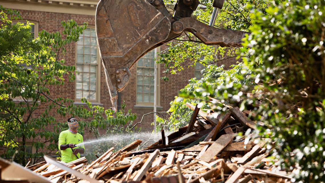 The remnants of three homes on White Oak Road in Raleigh are removed to make way for a parking lot behind Hayes Barton Baptist Church in Raleigh on Tuesday morning, June 7, 2022.