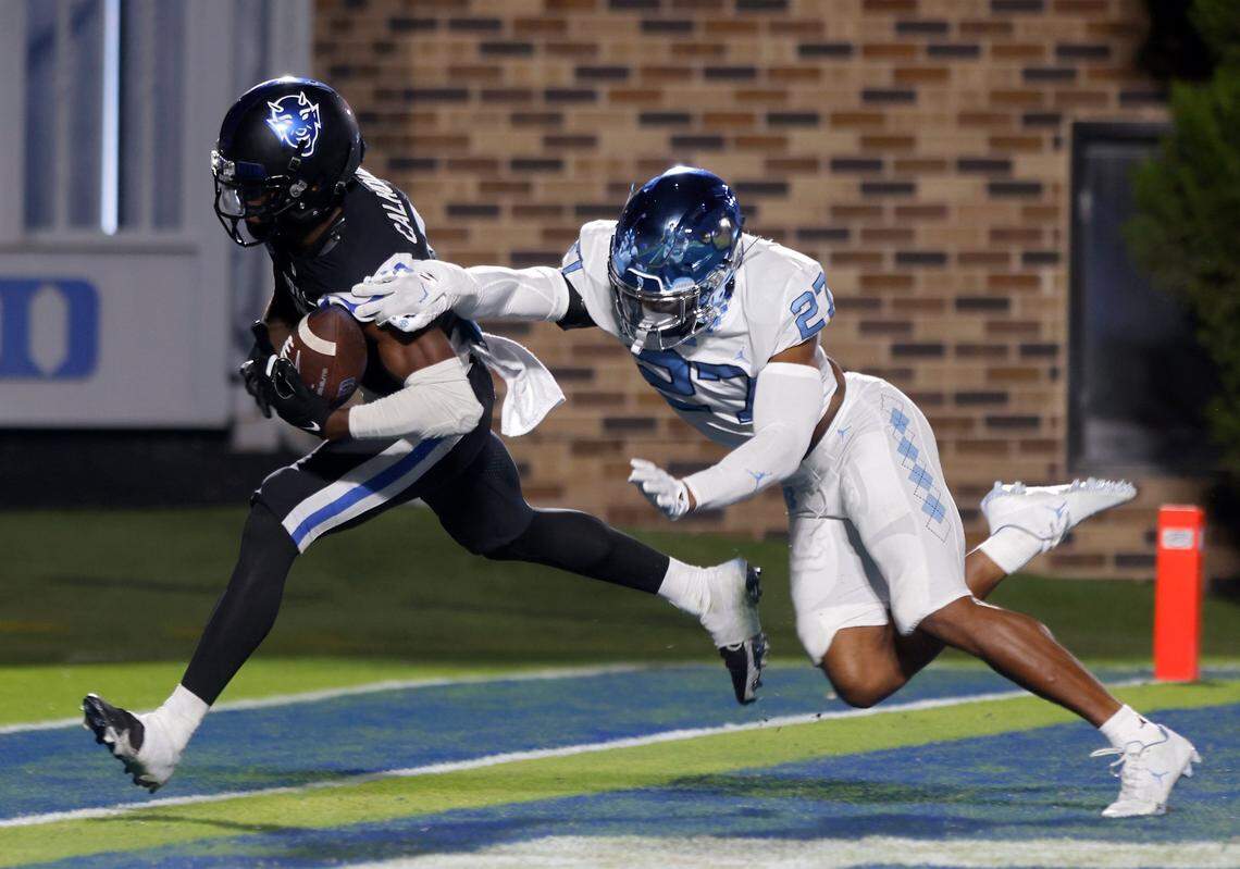 North Carolina Tar Heels defensive back Giovanni Biggers defends against a pass intended for Duke Blue Devils wide receiver Jalon Calhoun (5) during the first half of Saturday’s game at Wallace Wade Stadium in Durham, N.C.