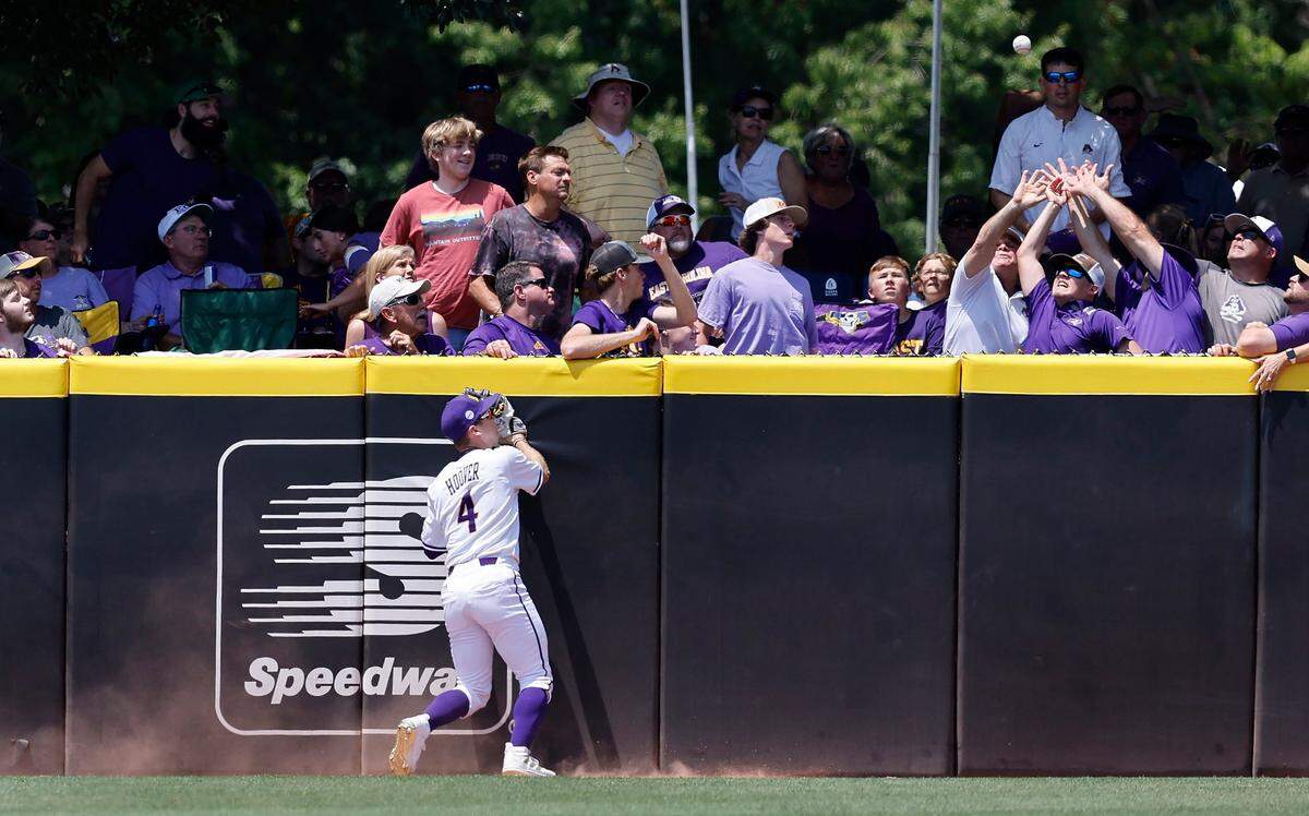 East Carolina’s Lane Hoover (4) watches as Texas Murphy Stehlys two-run homerun goes over the wall in the first inning during ECUs game against Texas in the Greenville Super Regional at Clark-LeClair Stadium Friday, June 10, 2022.