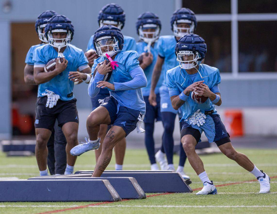 North Carolina football players run through drills during their spring practice on Wednesday, March 5, 2025 in Chapel Hill N.C. Under new coach Bill Belichick, players are not wearing numbers on their jerseys during workouts.