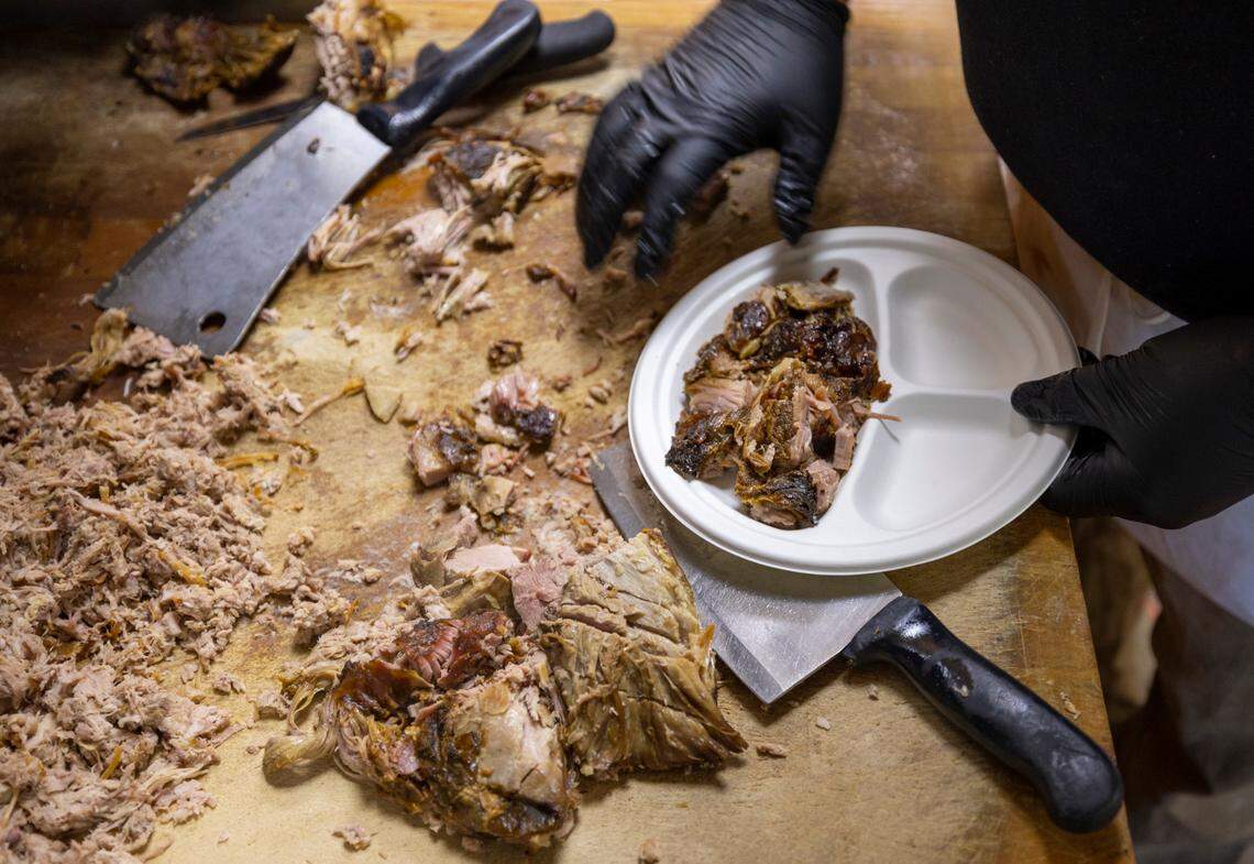 At Lexington Barbecue, a plate of course chopped barbecue is prepared in the kitchen on Tuesday, October 10, 2023 in Lexington, N.C.