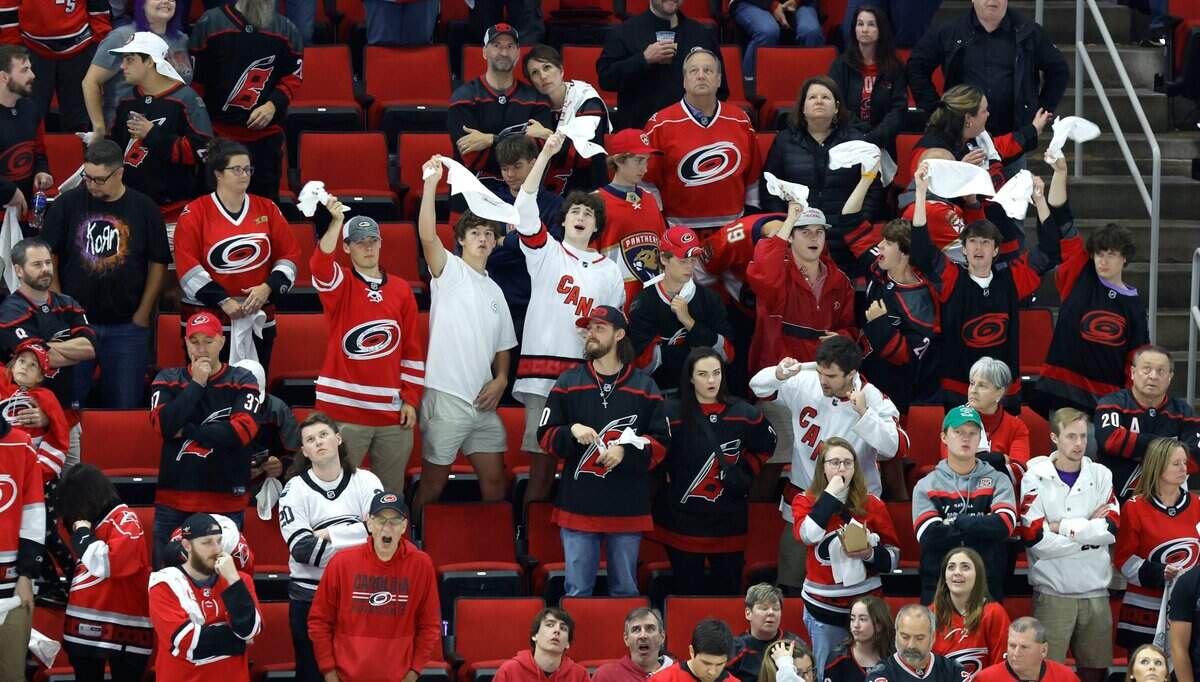 Fans cheer on the Canes during the third overtime of the Hurricanes’ game against the Florida Panthers in the first game of Eastern Conference Finals at PNC Arena in Raleigh, N.C., early Friday morning, May 19, 2023.