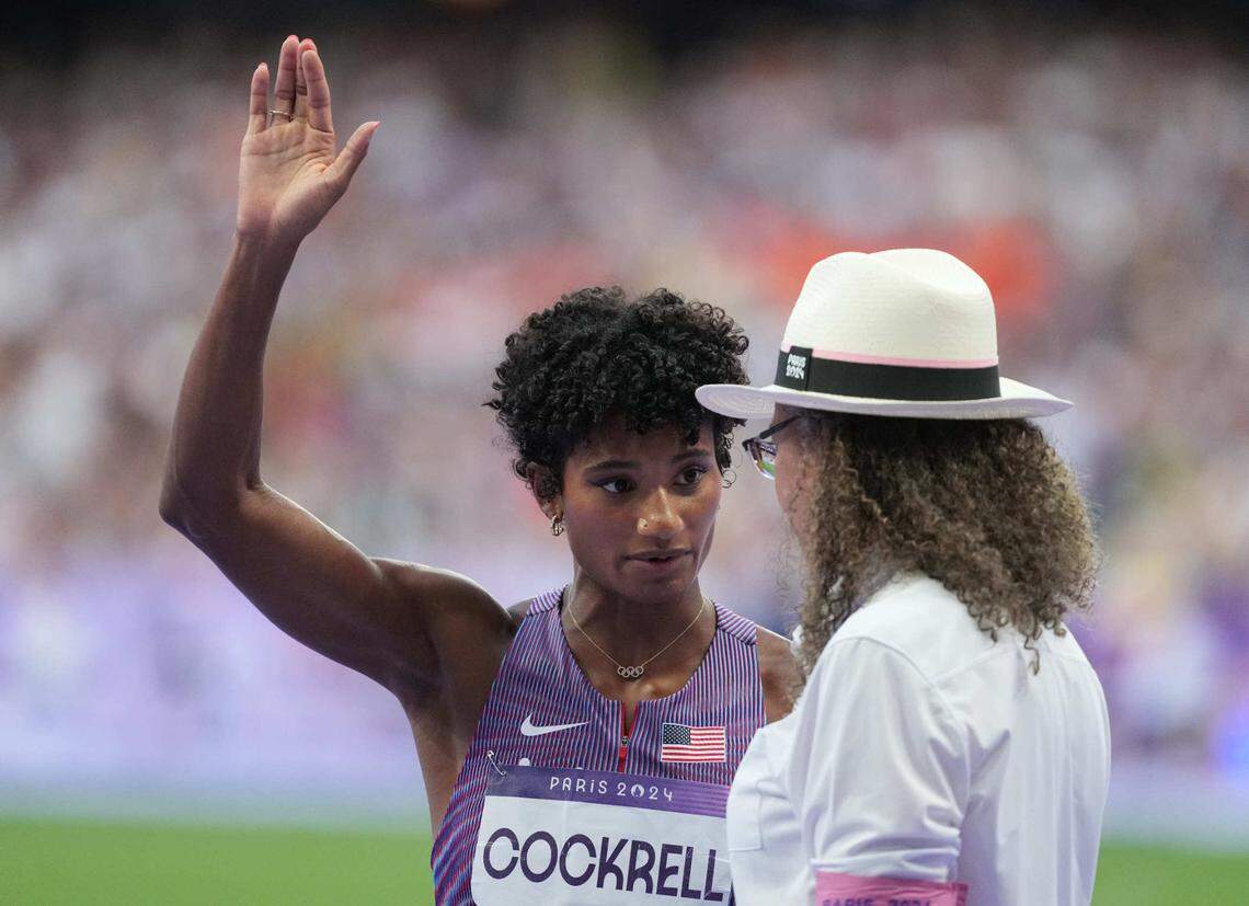 Aug 6, 2024; Saint-Denis, FRANCE; Anna Cockrell (USA) talks with an official at the start in the women’s 400m hurdles semifinals during the Paris 2024 Olympic Summer Games at Stade de France.