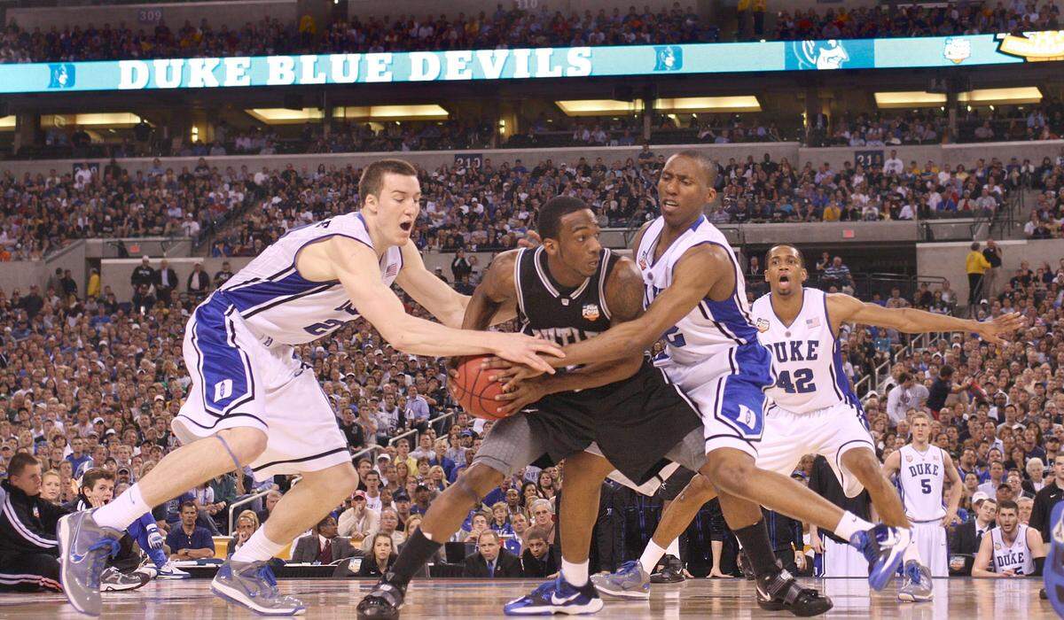 Duke’s Miles Plumlee, left, and Nolan Smith pressure Butler’s Shawn Vanzant during the Blue Devils’ 61-59 win over Butler for the 2011 NCAA National Championship.