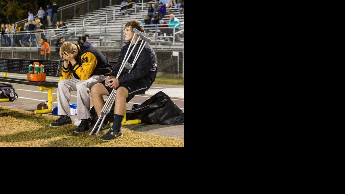 Chapel Hill High linebacker Coby Fisher, left, was taken out of a game with a head injury on Oct. 31 against Northwood and had to watch the second half of his team’s 52-33 loss from the sidelines. 
