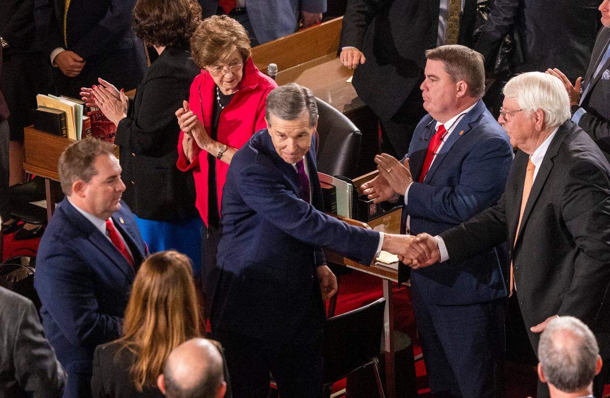 Gov. Roy Cooper leaves the House chamber after delivering his State of the State address to a joint session of the N.C. General Assembly on Monday, March 6, 2023.