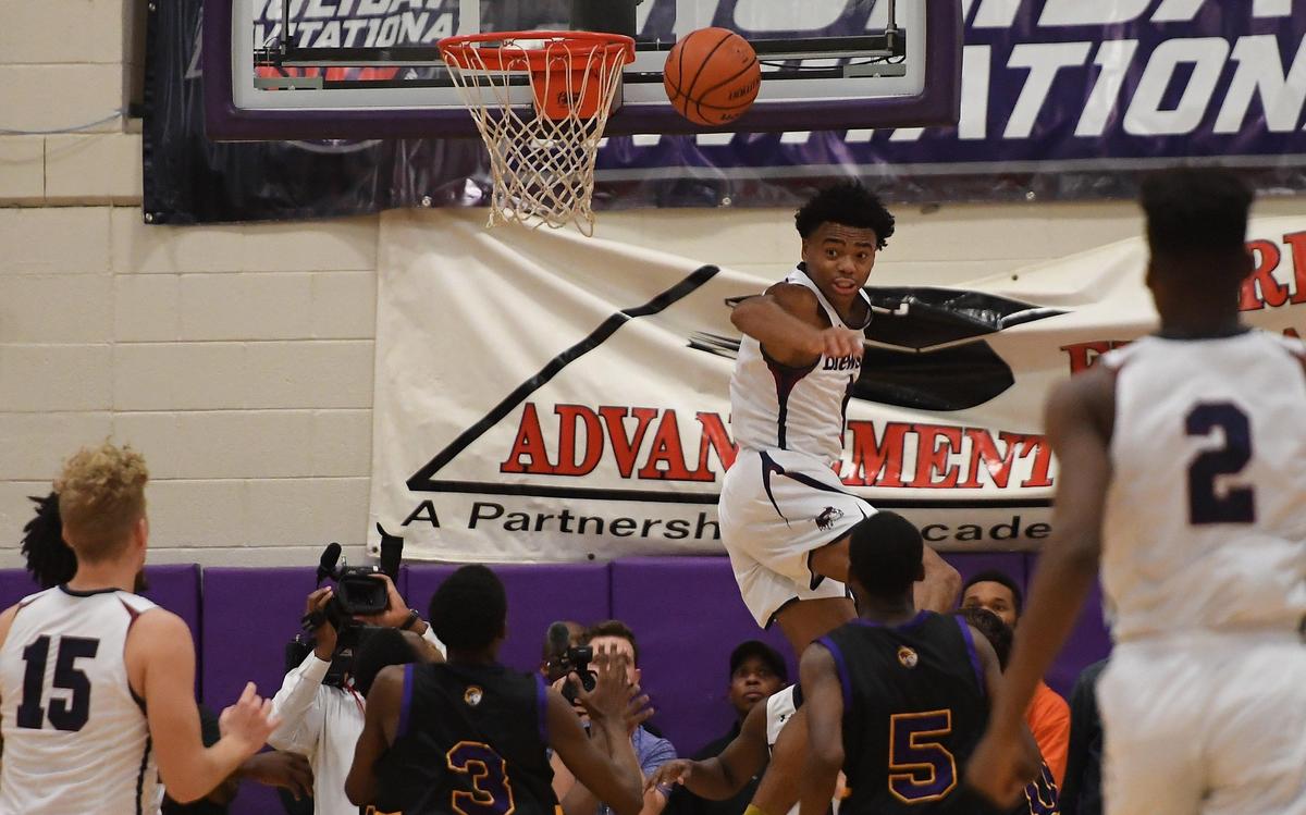 Jalen Lecque, center, of Brewster Academy blocks a shot against the Holy Rams. The Word of God Holy Rams played the Brewster Academy Bobcats in a high school basketball game that was part of the John Wall Holiday Invitational Tournament in Raleigh, N.C. on December 27, 2018.