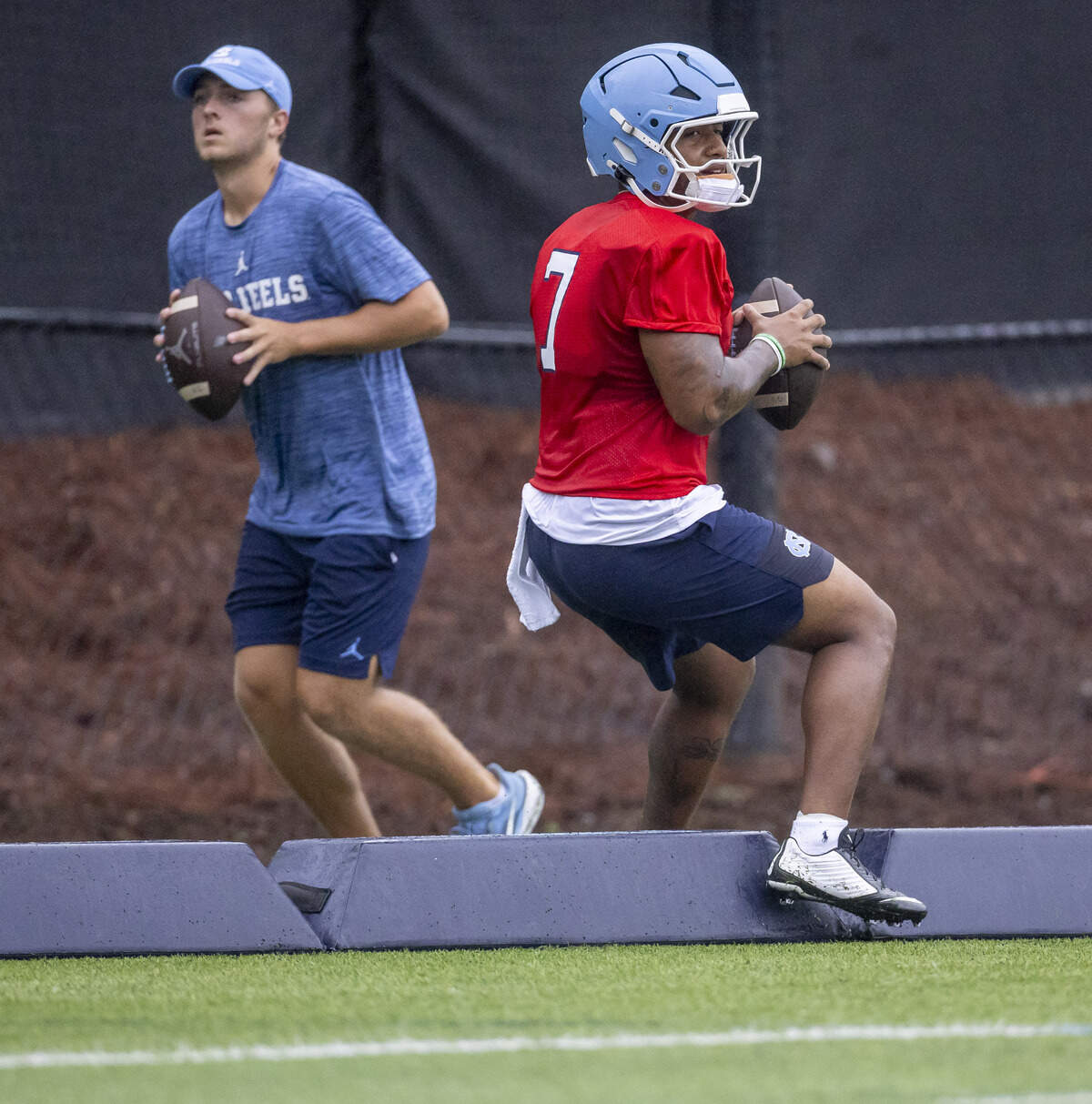 North Carolina quarterback Gio Lopez (7) runs through a drill station during the Tar Heels’ practice on Saturday, August 2, 2025 in Chapel Hill, N.C.