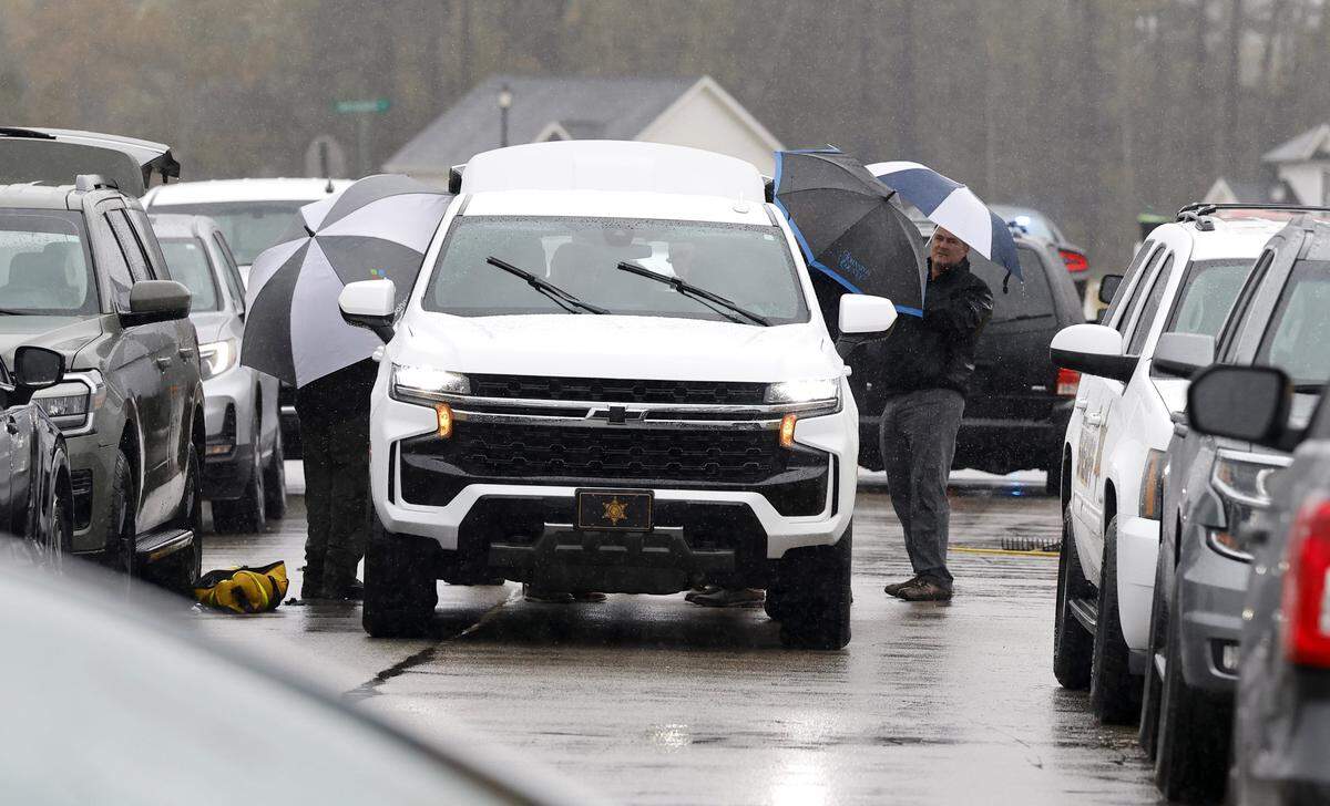 Investigators work outside a home on Springtooth Drive in Zebulon, N.C., on Tuesday, Oct. 28, 2025.
