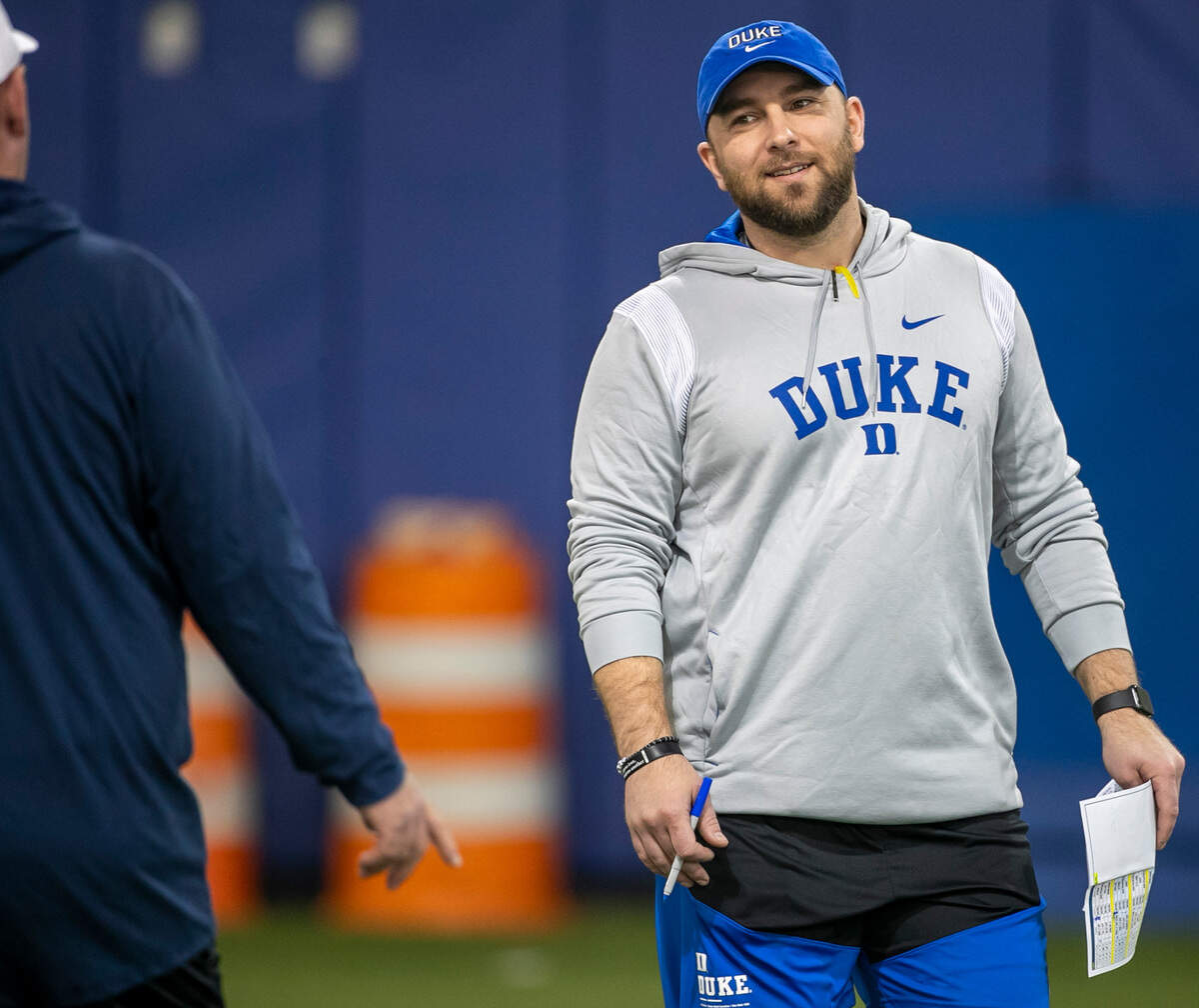 Duke defensive coordinator Tyler Santucci talks with head coach Mike Elko during the Blue Devils’ spring practice on Friday, March 24, 2023 in Durham, N.C.