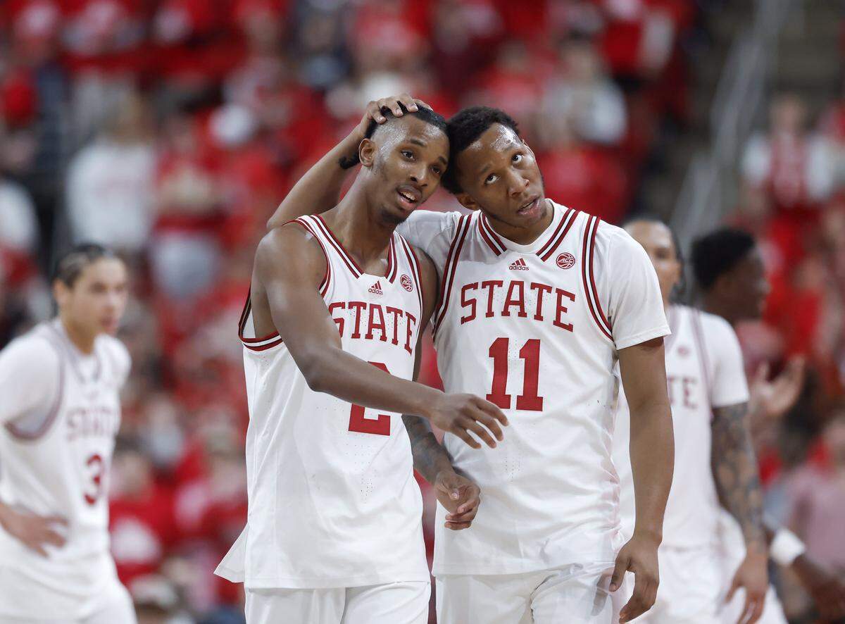 N.C. State’s Paul McNeil Jr. and Quadir Copeland walk down the court together during the second half of the Wolfpack’s 114-66 win over North Carolina Central at Lenovo Center on Monday, Nov. 3, 2025, in Raleigh, N.C.