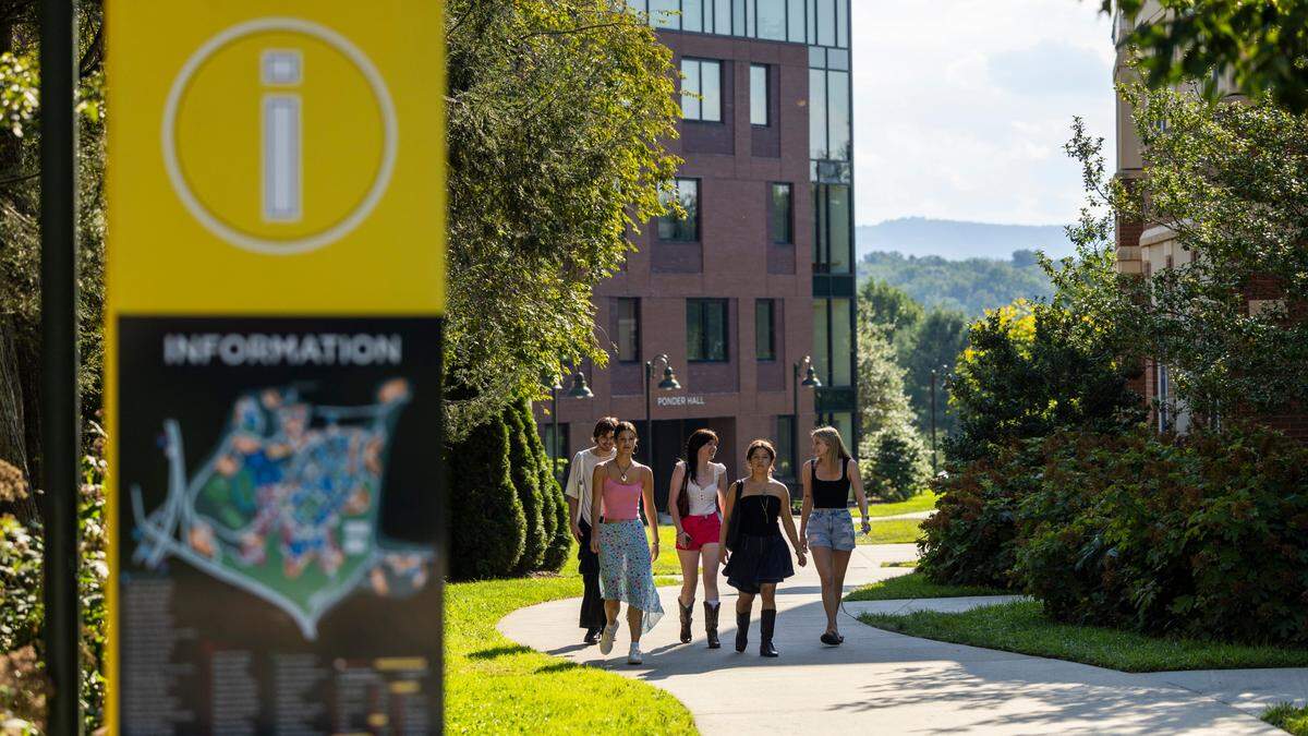 Students walk on UNC-Asheville’s campus on Friday, Aug. 15, 2024. Four departments are being eliminated from the liberal arts university’s curriculum.