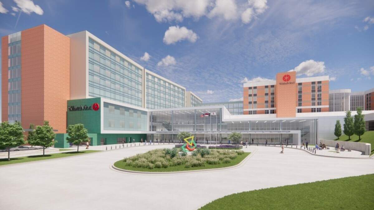 A rendering of the new building, left, that WakeMed hopes to build at its Raleigh campus on New Bern Avenue. The new building would put a larger emergency department and modern operating rooms and intensive care units in one place on WakeMed’s flagship campus, the county’s only Level 1 trauma center.