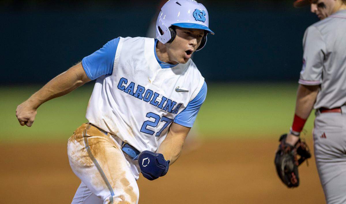 North Carolina outfielder Kane Kepley (27) reacts as he rounds third base, heading home to score on a home run by teammate Jackson Van De Brake in the seventh inning against N.C. State on Friday, May 9, 2025 at Boshamer Stadium in Chapel Hill, N.C.