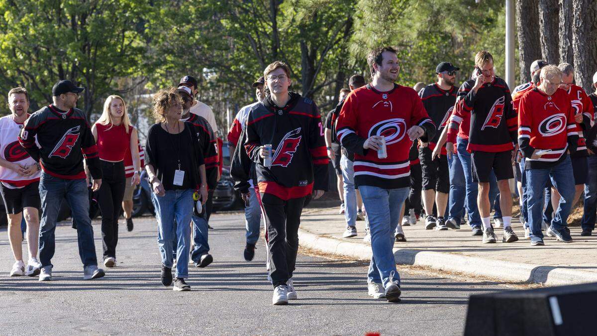 Carolina Hurricanes fans get ready for Game 1 of the Stanley Cup Final outside the Lenovo Center in Raleigh on Tuesday, June 2, 2026. For the first time since 2006, the Hurricanes are playing in the Stanley Cup Final, facing the Vegas Golden Knights, who won the Stanley Cup in 2023.