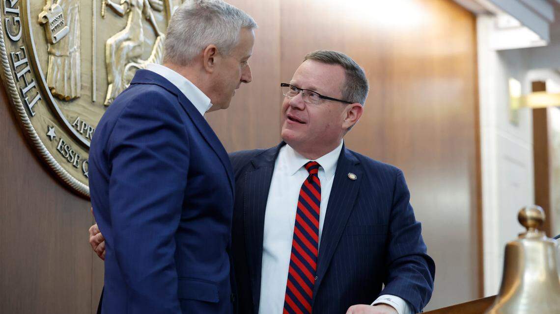 Speaker of the N.C. House of Representatives, Tim Moore, talks with Michael Whatley, chairman of the N.C. GOP after the opening session of the House on Jan. 11, 2023.
