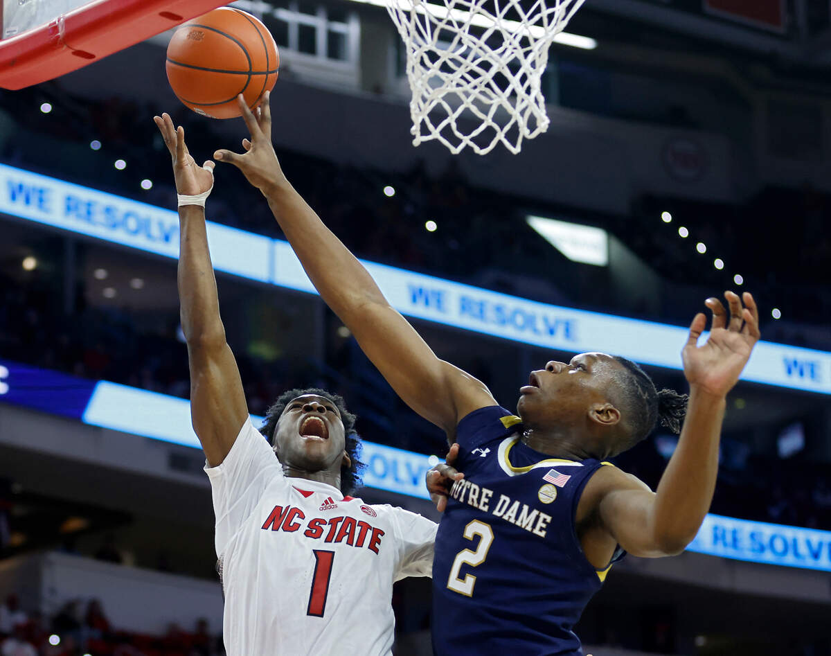 North Carolina State’s Jarkel Joiner drives to the basket against Notre Dame’s Ven-Allen Lubin during the first half of a men’s basketball game at PNC Arena on Tuesday, Jan. 24, 2023, in Raleigh, N.C. 