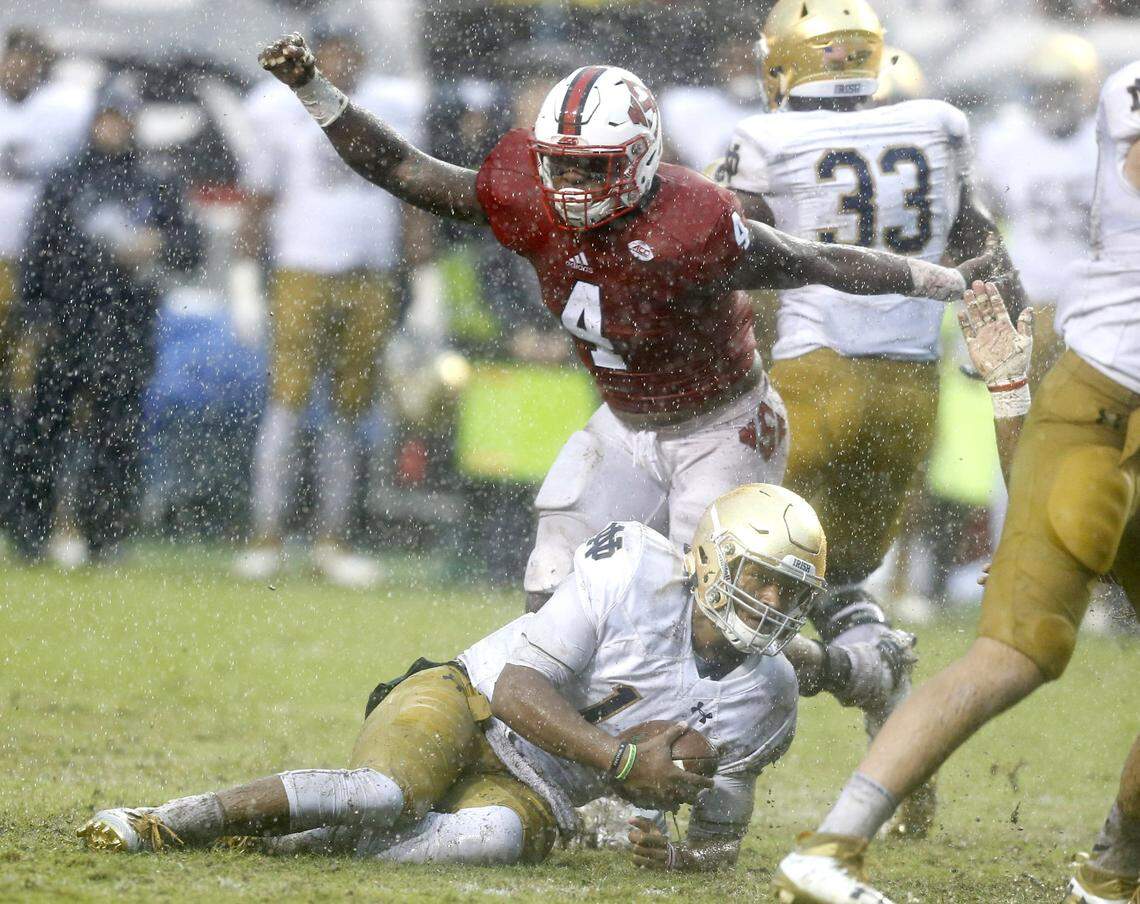 N.C. State linebacker Jerod Fernandez (4) celebrates after Notre Dame quarterback DeShone Kizer (14) was sacked during the first half of the Wolfpack’s game against Notre Dame at Carter-Finley Stadium in Raleigh, N.C., Saturday, Oct. 8, 2016.