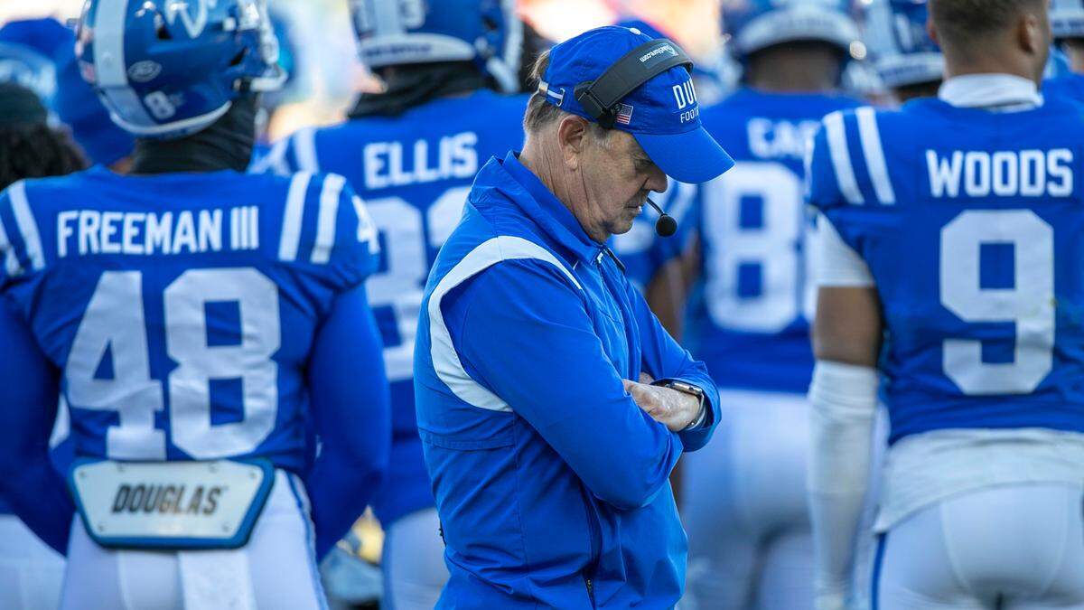 Down 47-10 to Miami, Duke coach David Cutcliffe paces behind his players as they huddle with coordinators at the start of the fourth quarter on Saturday, November 27, 2021 at Wallace Wade Stadium in Durham, N.C.