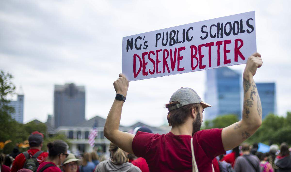Demonstrators gather for the May Day protest on the Halifax Mall, calling for higher teacher pay, an end to corporate tax breaks and private school vouchers, on Friday, May 1, 2026 in Raleigh, NC.