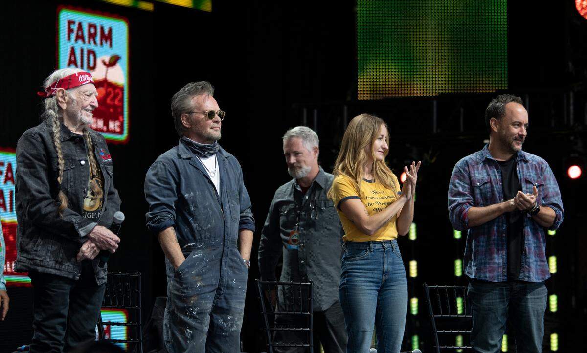 Willie Nelson, John Mellencamp, Margo Price and Dave Matthews applaud farmers at a gathering before the start of Farm Aid at Raleigh, N.C.’s Coastal Credit Union Music Park at Walnut Creek, Saturday, Sept. 24, 2022.