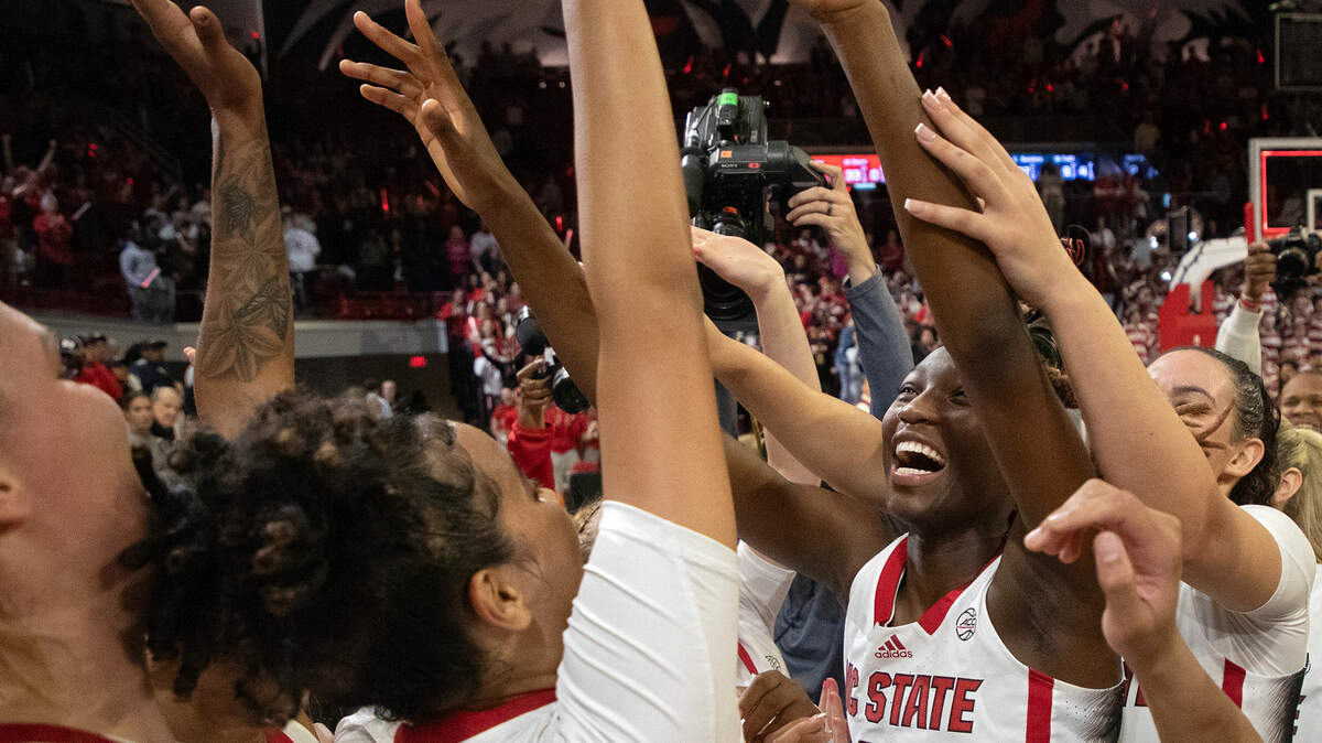 N.C. State’s Saniya Rivers celebrates with teammates after the Wolfpack defeated UConn 92-81 on Nov. 12 at Reynolds Coliseum in Raleigh, N.C. On Wednesday, Rivers had 22 points to lead N.C. State to a win over Vanderbilt.