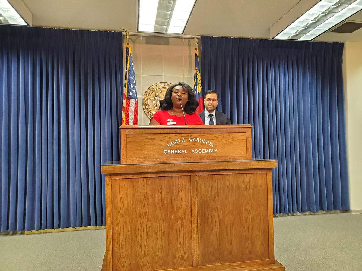 North Carolina Association of Educators President Tamika Walker Kelly, a teacher, talks to reporters about NCAE budget priorities and educator pay during a press conference at the Legislative Building in Raleigh on June 22, 2022.