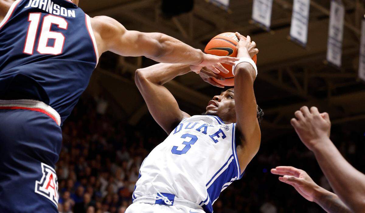 Duke’s Jeremy Roach (3) shoots as Arizona’s Keshad Johnson (16) defends during the second half of Arizona’s 78-73 victory over Duke at Cameron Indoor Stadium in Durham, N.C., Friday, Nov. 10, 2023.