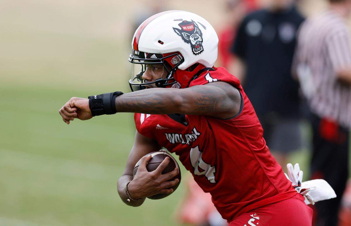 N.C. State wide receiver Porter Rooks (4) runs a drill during the Wolfpack’s first spring practice in Raleigh, N.C., Wednesday, March 1, 2023.
