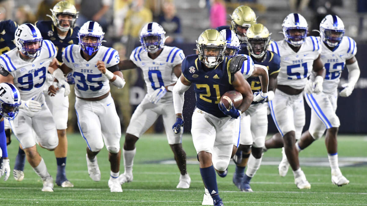 November 28, 2020 Atlanta - Georgia Tech’s running back Jahmyr Gibbs (21) runs for a touchdown during the first half of an NCAA college football game at Georgia Tech’s Bobby Dodd Stadium in Atlanta on Saturday, November 28, 2020.