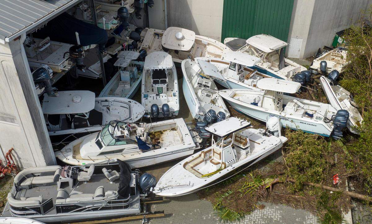 Boats are stacked up against the Port Sanibel Marina Hotel after Hurricane Ian ran through the areaThursday, Sept. 29, 2022, in Fort Meyers, Fla.