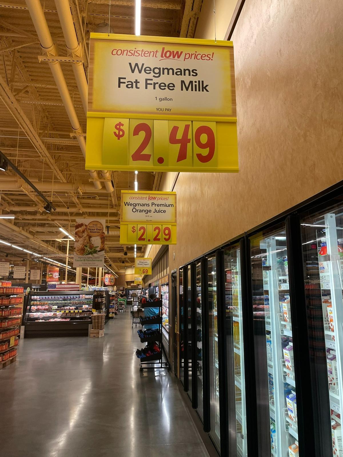 Milk and orange juice prices at Wegmans grocery store in Raleigh on June 27.