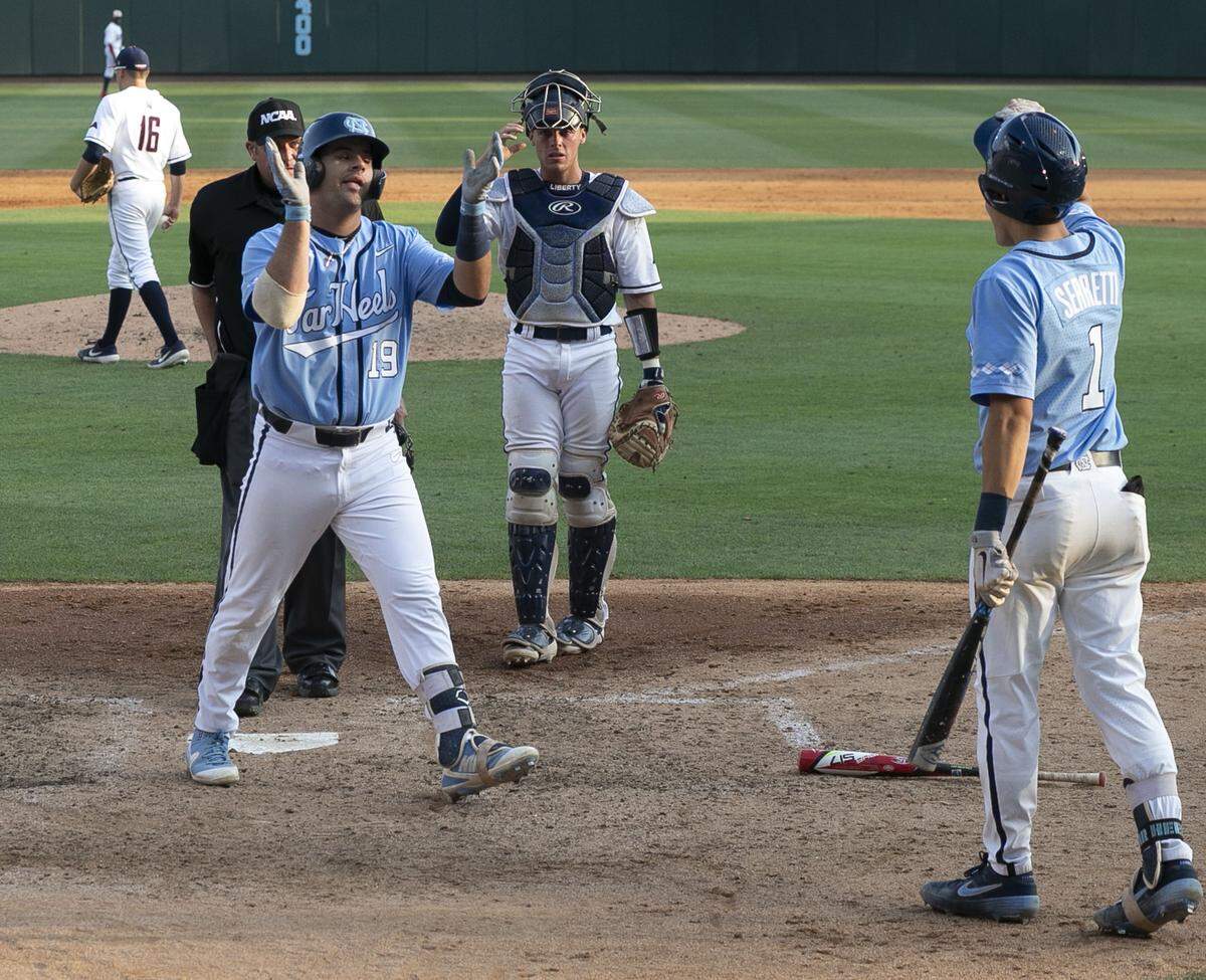 North Carolina Aaron Sabato (19) celebrates after scoring on a home run in the seventh inning against Liberty during the NCAA regional on Saturday, June 1, 2019 at Boshamer Stadium in Chapel Hill, N.C.
