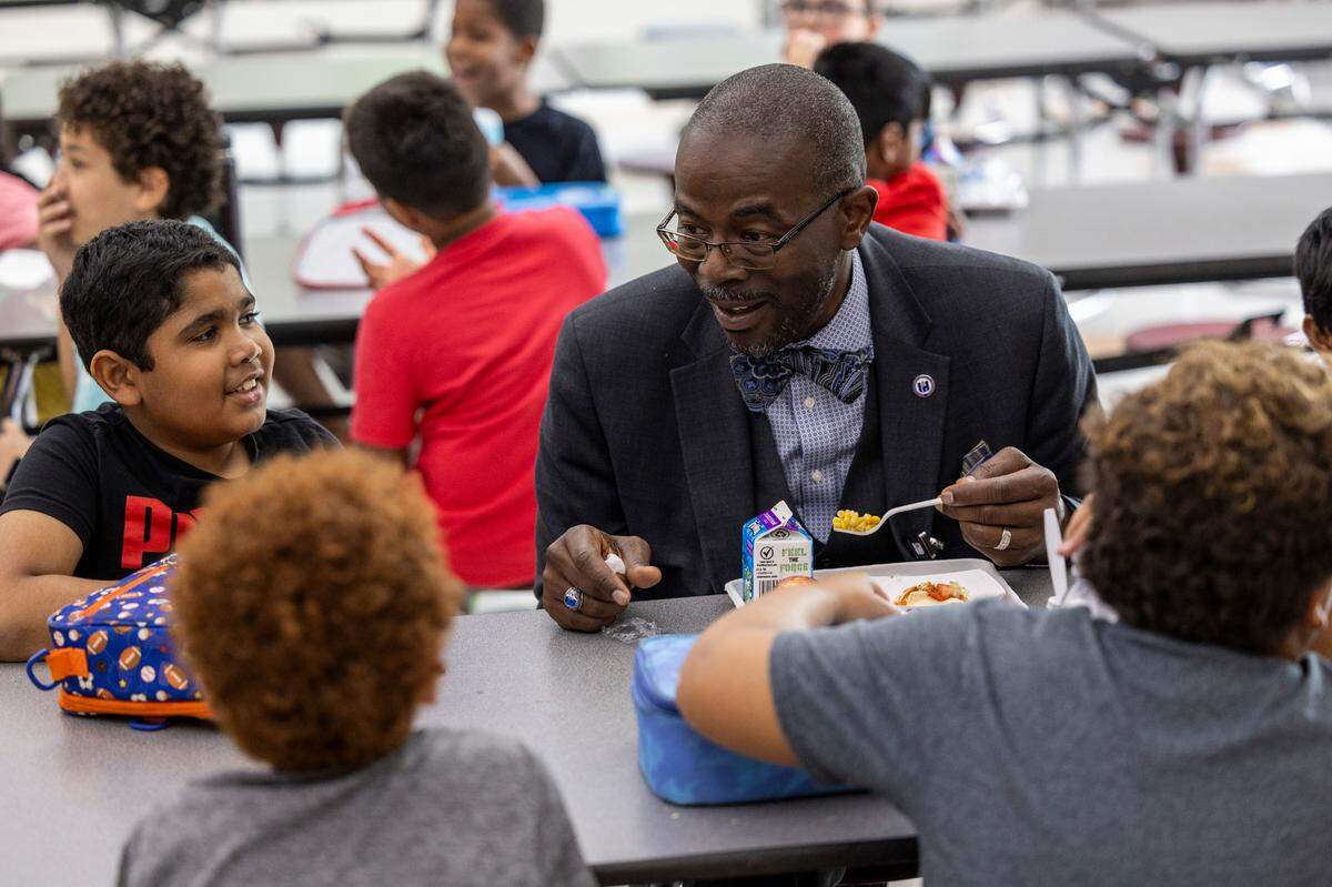 Wake County Schools Superintendent Robert Taylor eats lunch with students at Kingswood Elementary in Cary on Tuesday, June 4, 2024.  Taylor is warning that school meals prices are expected to rise again in the 2026-27 school year.