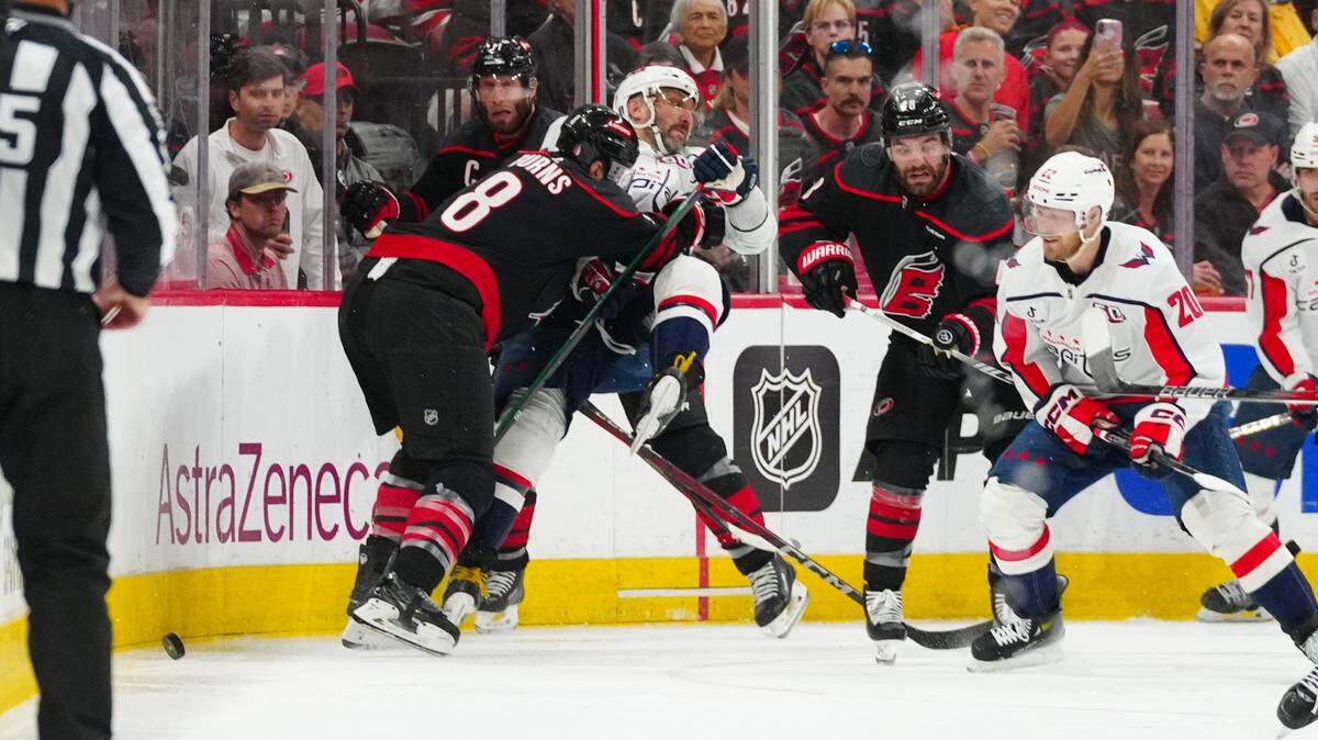 May 10, 2025; Raleigh, North Carolina, USA; Carolina Hurricanes defenseman Brent Burns (8) checks Washington Capitals left wing Alex Ovechkin (8) during the second period in game three of the second round of the 2025 Stanley Cup Playoffs at Lenovo Center. Mandatory Credit: James Guillory-Imagn Images