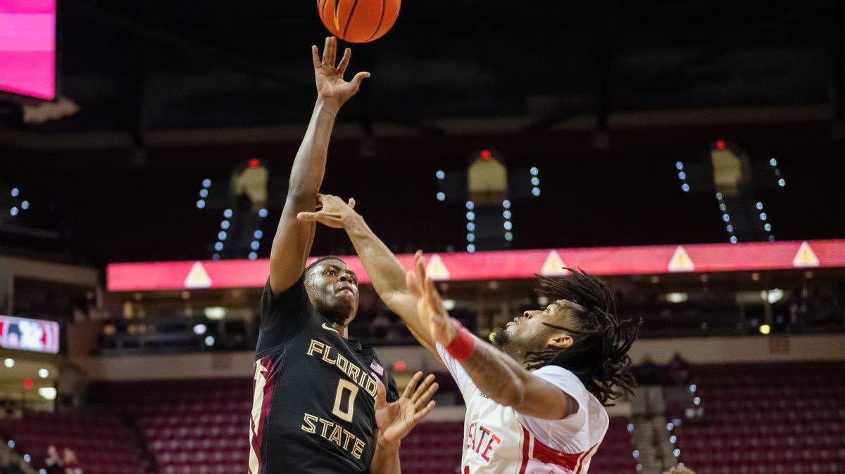 NC State’s Jayden Taylor attempts to defend Florida State’s Chandler Jackson in first half action of the Wolfpack’s loss to Florida State, Tuesday night, Feb. 27, 2024.