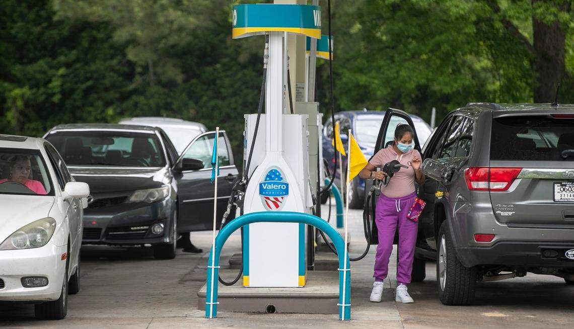 Customers line up for fuel at the at the Valero on Western Blvd. on Tuesday, May 11, 2021 in Tarboro, N.C. Several surrounding stations were without fuel on Tuesday morning, forcing customers to wait in line for about 15 minutes to fill their tanks due to the closure of the Colonial Pipeline by a cyberattack.