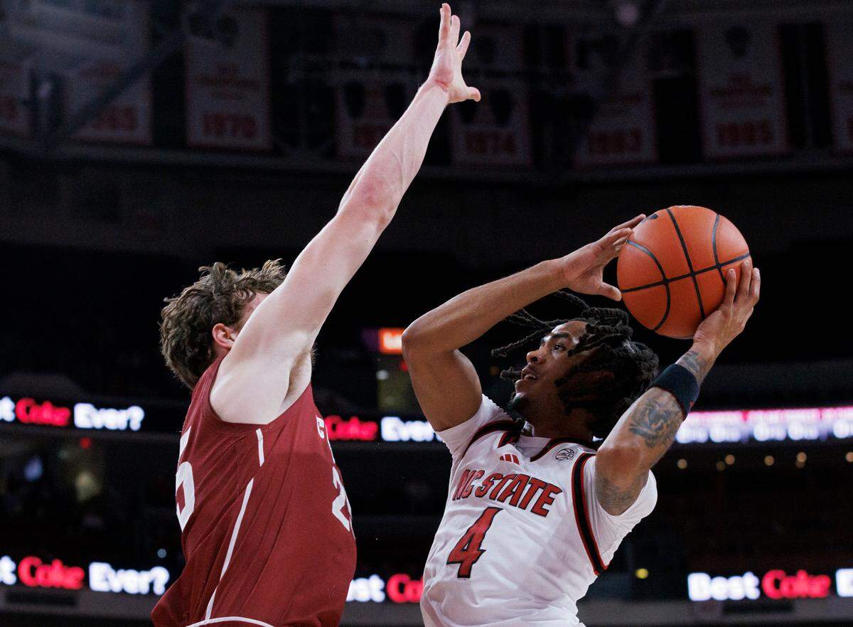 N.C. State’s Breon Pass drives to the basket against Colgate’s Parker Jones during the first half of the Wolfpack’s 72-49 win at Lenovo Center on Monday, Nov. 18, 2024, in Raleigh, N.C.