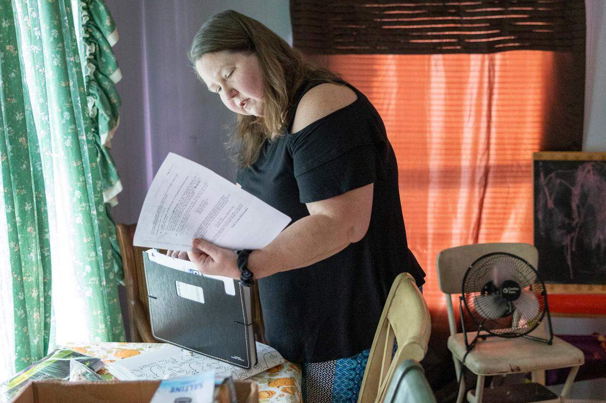 DeAnna Brandon’s, 45, of Salisbury looks through some of her medical bills and documents. Brandon was recently diagnosed with multiple myeloma, a rare blood cancer. Brandon does not have insurance and charity care, through which hospitals provide free or discounted services to eligible low-income patients, won’t cover the cost of up to $200,000 to harvest and transplant her own stem cells.