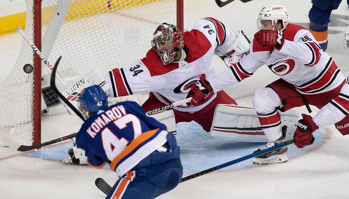 New York Islanders’ Leo Komarov (47) shoots on Carolina Hurricanes goalie Petr Mrazek (34) in the second period during Game 2 of the second round Stanley Cup series on Sunday, April 28, 2019 a Barclays Center in Brooklyn, N.Y.