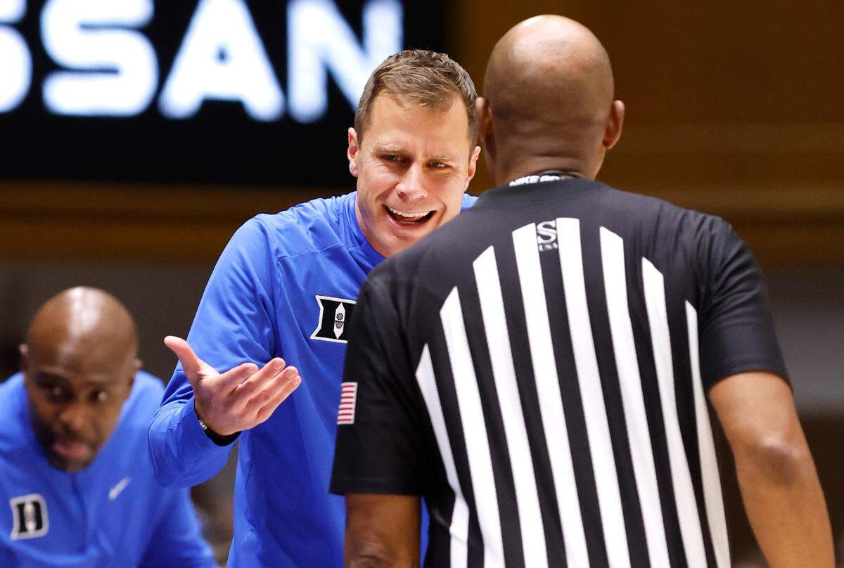Duke head coach Jon Scheyer questions a call with official Bert Smith during the first half of Duke’s game against Arizona State in the Brotherhood Run Charity Game at Cameron Indoor Stadium in Durham, N.C., Sunday, Oct. 27, 2024.
