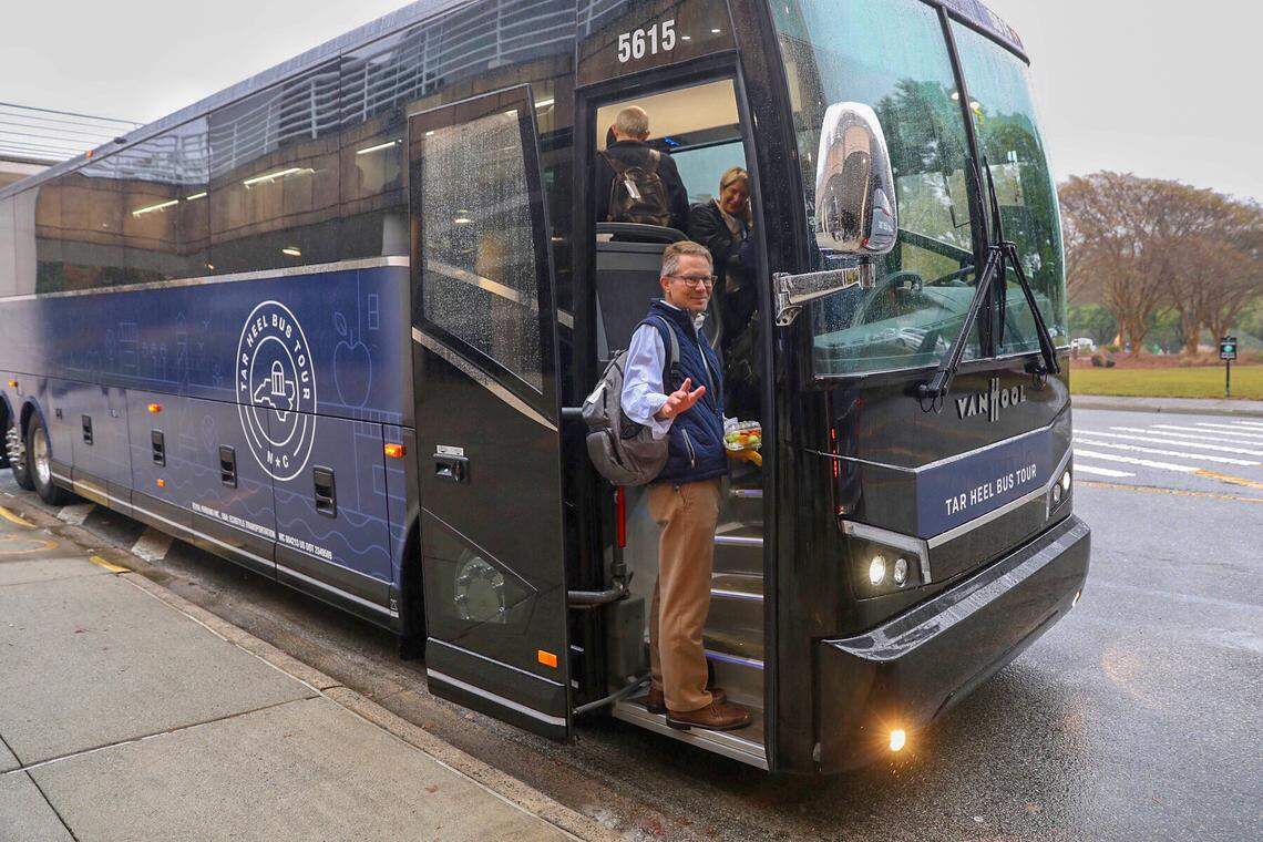 Kevin Guskiewicz, UNC interim chancellor, boards one of the buses taking faculty and administrators on a three-day tour of the state.