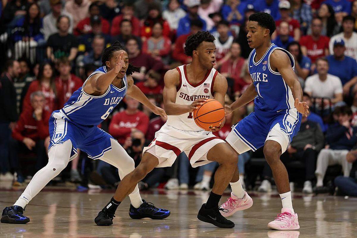 PALO ALTO, CALIFORNIA - JANUARY 17: Ebuka Okorie #1 of the Stanford Cardinal is guarded by Maliq Brown #6 an Caleb Foster #1 of the Duke Blue Devils during the first half at Stanford Maples Pavilion on January 17, 2026 in Palo Alto, California. (Photo by Ezra Shaw/Getty Images)