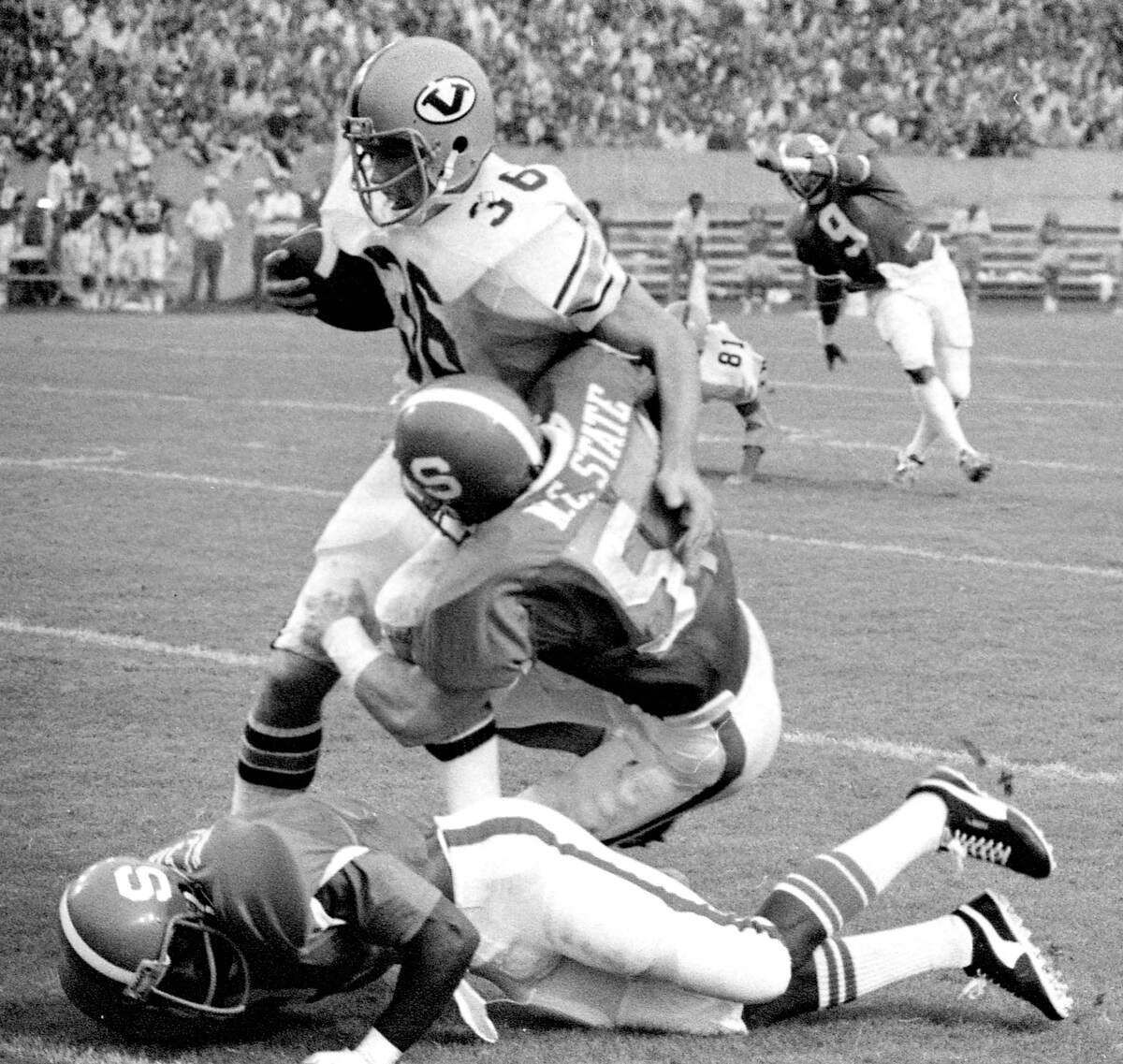 N.C. State’s Bill Cowher (54) stops Virginia’s Paul Izlar during the Wolfpack’s 14-0 victory at Carter Stadium in Raleigh, N.C. in September 1977.