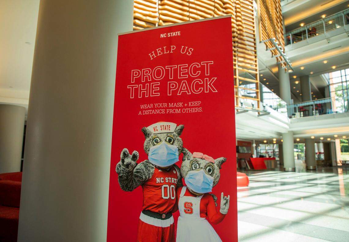 Signs in Talley Student Union at N.C. State University remind students who will be returning to campus for the fall semester to follow safety protocols in place to prevent the spread of COVID-19, on Wednesday, July 22, 2020, in Raleigh, N.C.