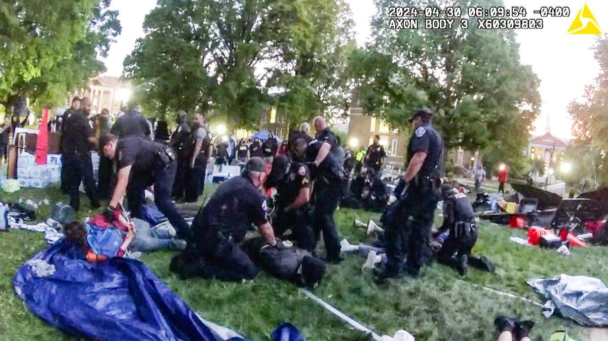 A still taken from body camera video shows law enforcement officers taking pro-Palestinian protesters into custody as they clear an encampment on campus, April 30, 2024.
