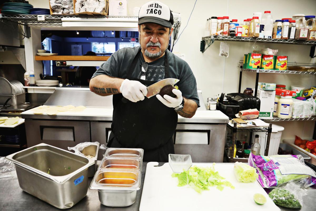 13 Tacos & Taps owner/chef David Peraza-Arce makes a salad in the North Raleigh restaurant on Tuesday, Aug. 6, 2019.