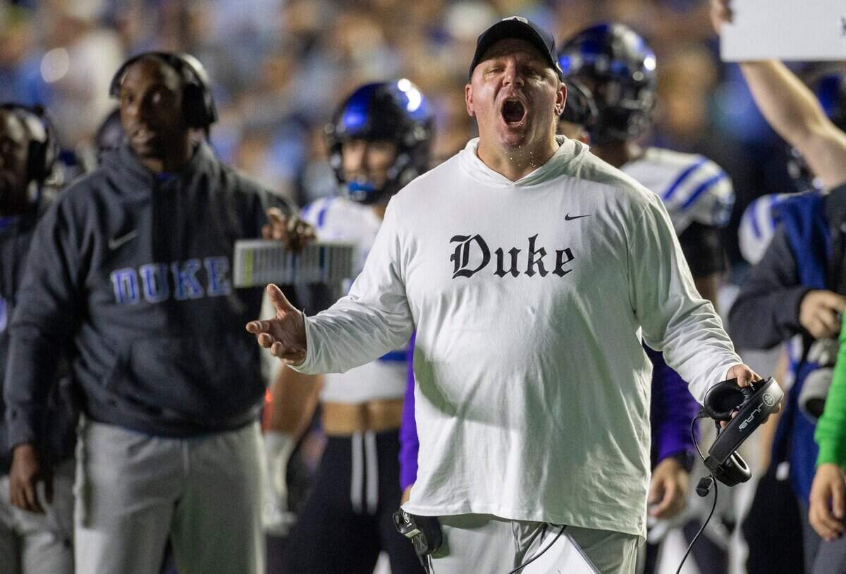 Duke coach Mike Elko directs his team on defense in the first quarter against North Carolina on Saturday, Nov. 11, 2023 at Kenan Stadium in Chapel Hill, N.C.