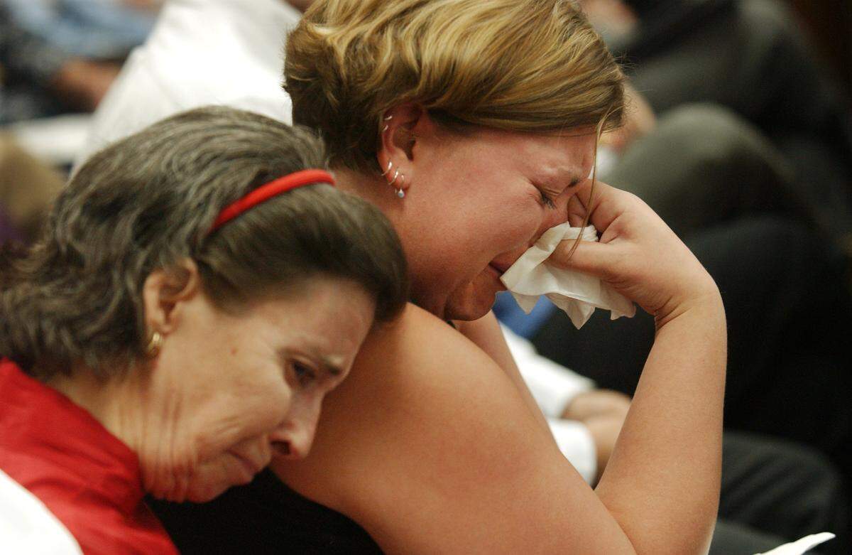 Stephanie Piscitelli, right, and Debbie Bowes listen as Lauren Murphy, girlfriend of Dennis Bowes, talks about her slain boyfriend before Larry Robert Veeder Jr.  was sentenced Friday April 23, 2004 in the Wake County Courthouse. Veeder was being sentenced after pleading guilty for killing Bowes and five others after driving into them November 1, 2003.  Debbie Bowes is Dennis Bowes's step mother.  Piscitelli is friends of both Dennis Bowes and Bryan Tutor, who was also killed by Veeder.  