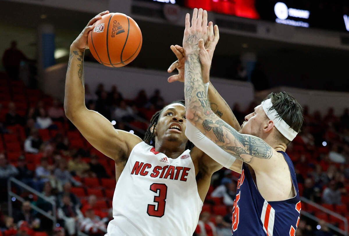 N.C. State’s MJ Rice (3) heads to the basket as UT Martin’s Jacob Crews (35) defends during the second half of N.C. State’s 81-67 victory over UT Martin at PNC Arena in Raleigh, N.C., Tuesday, Dec. 12, 2023.